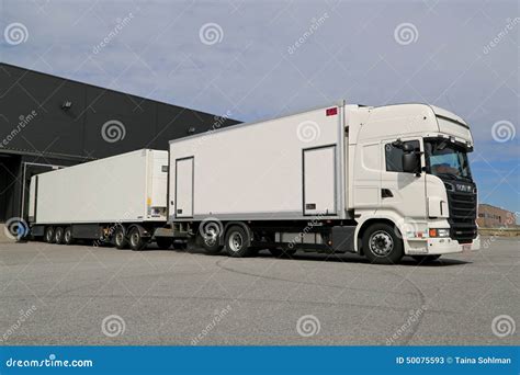 White Scania R560 Full Trailer Unloading At A Warehouse Editorial Stock Photo - Image: 50075593