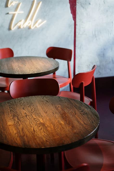 Brown Wooden Round Table and Red Chairs · Free Stock Photo