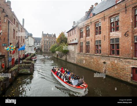 Canal boat tour in Bruges, Belgium Stock Photo - Alamy