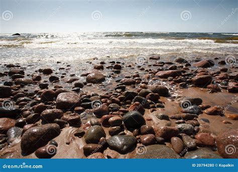 Rock and sand beach stock photo. Image of water, rives - 20794280