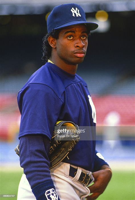 Deion Sanders of the New York Yankees looks on during batting... News ...