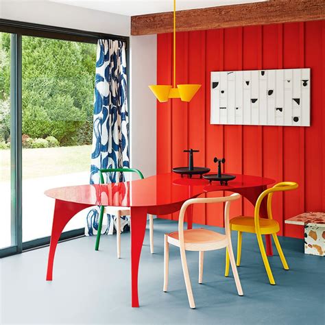 Bright red and blue dining room with yellow accents Red Interior Design, Yellow Interior, Yellow ...