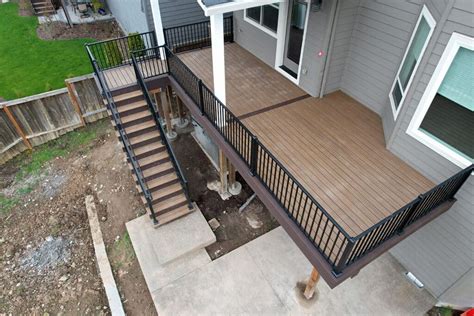 Sleek Black Deck Railing Installation For Dramatic Results