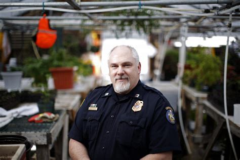 Ryan Fries, a captain at Maine State Prison in Warren, in a greenhouse where inmates work ...