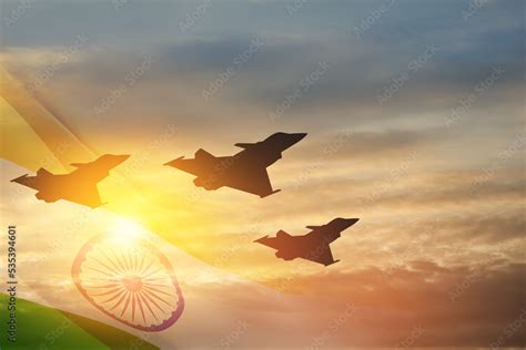 Indian Air Force Day. Indian jet air shows on background of sunset with transparent Indian flag ...