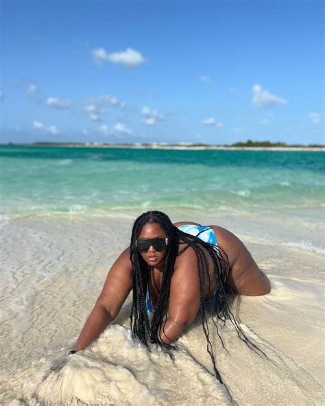 Lizzo leaves little to the imagination in blue bikini