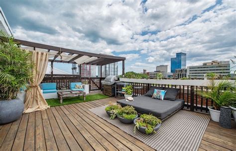 Large rooftop deck in the South Loop of Chicago with city views, wooden ...