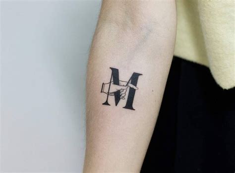 Letter M with a hand by tattooist Fury Art | Cool arm tattoos, Hand ...