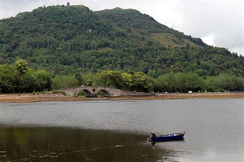 A bridge and a boat on the loch at Inveraray, Scotland Photograph by Decor And Wall Art - Fine ...