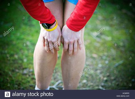 Human Hands On Knee Stock Photos & Human Hands On Knee Stock Images - Alamy