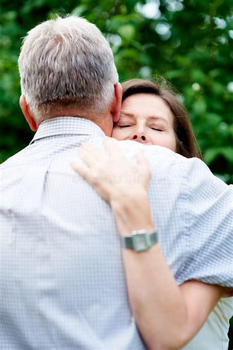 I Feel Safe in His Arms. an Affectionate Senior Couple Embracing in the ...