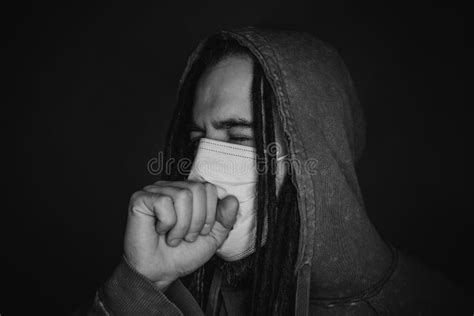 Coughing young man in mask stock photo. Image of pollution - 208092610