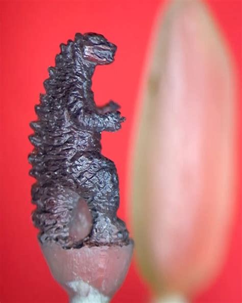 Carving Godzilla On A Grain Of Rice | Carving Godzilla is hard enough, but what about doing it ...