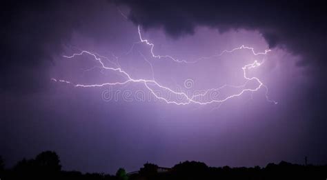 Lightning in a stormy sky stock image. Image of charge - 99490373