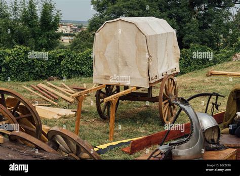 Half-built wooden medieval chariot outside on grass, the construction process Stock Photo - Alamy