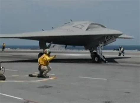 Unmanned X-47B jet makes history after successfully landing on aircraft ...