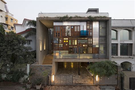 S+PSARCHITECTS adds recycled doors and windows to mumbai house façade