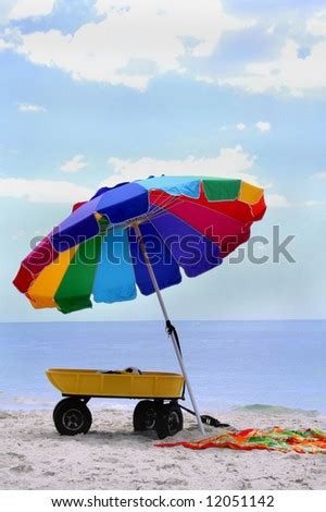 Colorful Beach Umbrella On Beach With Towel And Wagon Stock Photo 12051142 : Shutterstock