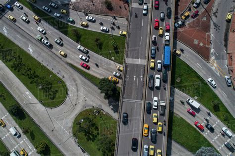 Drone view of traffic on streets in city, Bogota, Columbia - Stock Photo - Dissolve