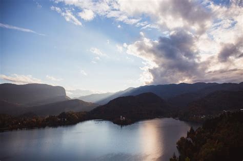 Premium Photo | Lake bled island in the lake at sunrise in autumn or winter