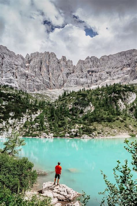 Male Backpacker Enjoying Turquoise Lago Di Sorapiss Mountain Lake ...