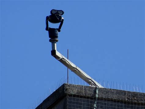 CCTV Camera On High Building Corner Free Stock Photo - Public Domain Pictures