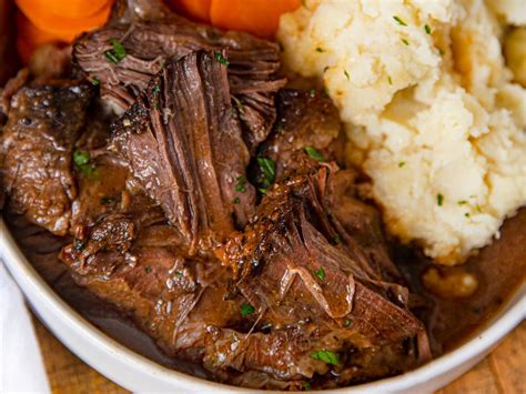 Crockpot Sweet and Tangy Pot Roast made in the slow cooker is a cross ...