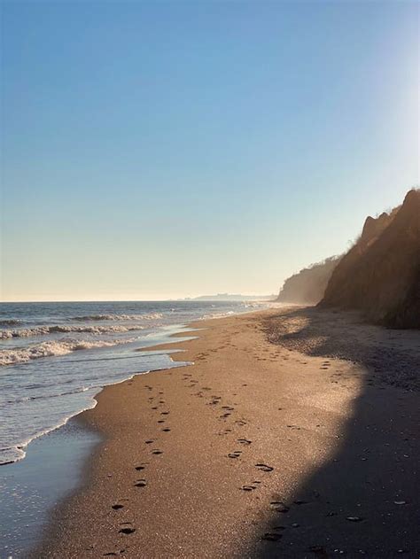 Footprints on Sand Beach on Sunset · Free Stock Photo