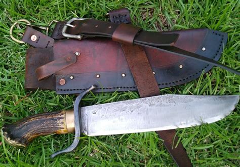 Massive Bowie with hand-crafted leather sheath. Moose antler handle, iron trailing S-Guard ...