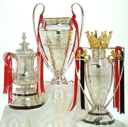 Manchester United : FA Cup, Champions League trophy and Premiership trophy. I met the ...