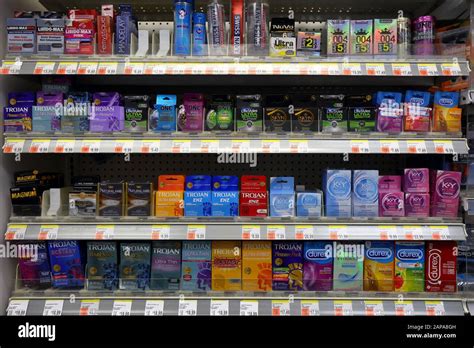 A wide variety and different brands of condoms on a store shelf at a drug store pharmacy Stock ...