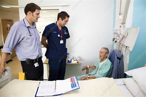 Hospital doctors on their rounds - Stock Image - C002/3695 - Science Photo Library