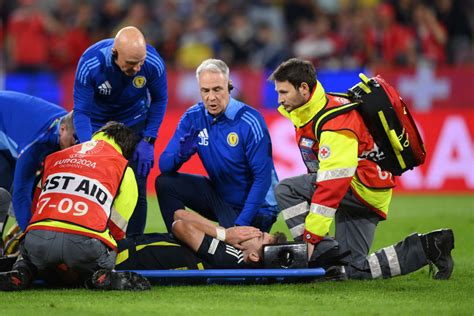 Kieran Tierney injury update after Scotland star is stretchered off in ...