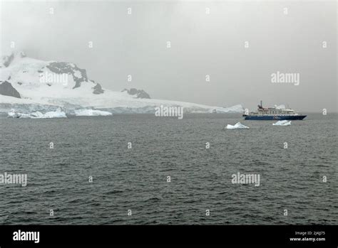 Exploring Antarctica - Quark Expeditions Sea Spirit Cruise Ship sailing among the Icebergs ...