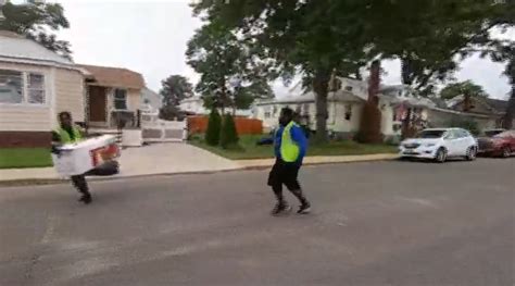 Hilarious footage of dancing trash collectors recorded on home security cam goes viral