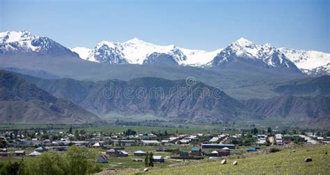 The Village of Kyzyl Tuu with the Tian Shan Mountains in the Background in Kyrgyzstan Stock ...