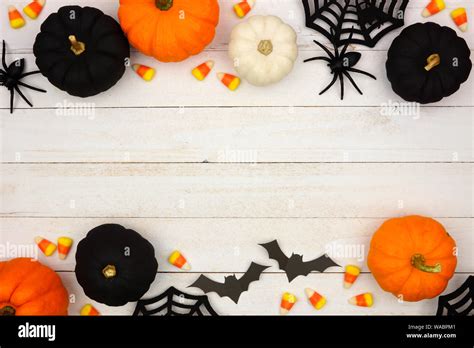 Halloween double border with black, orange and white decor and candy ...