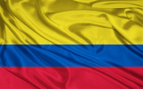 Flag: In this picture it shows a colombian flag. Yellow on the flag represents the gold that is ...