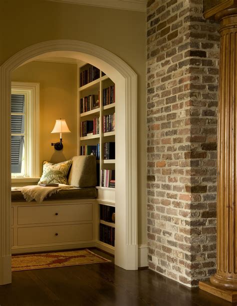 Reading Alcove with Day Bed and Bookshelves beyond Cased Arch and Brick Wall | Traditional ...