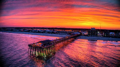 Sky On Fire Sunset - Garden City Pier Photograph by Robbie Bischoff - Fine Art America