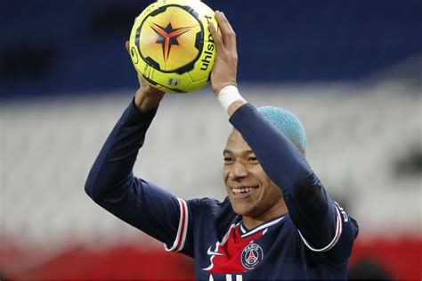 Football: Blue-haired Mbappe helps PSG keep pace with Lille – Filipino News