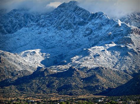 Snow Covered Sandia Peaks Photograph by Aaron Burrows