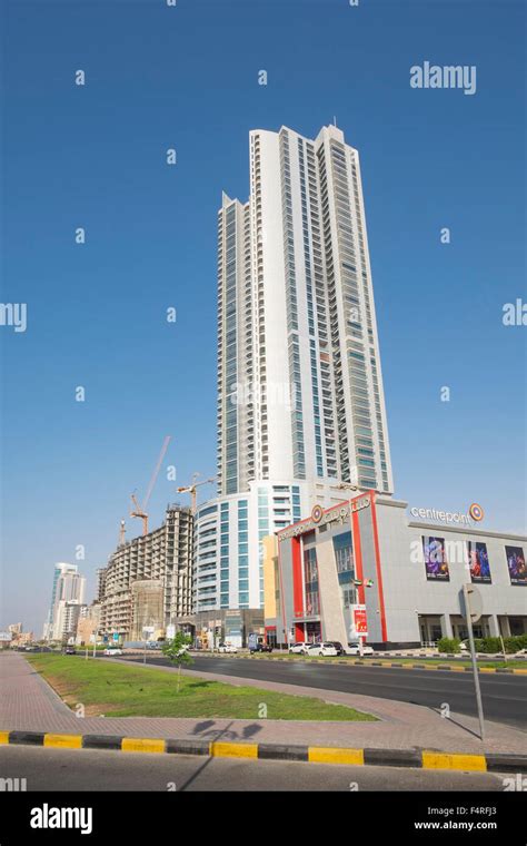 View of street and high-rise Corniche Tower along Corniche in Ajman ...