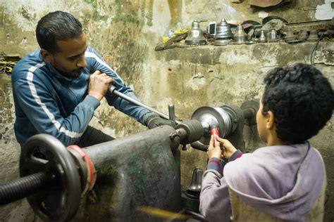 Metalworker | A metalworker and his young assistant shape a … | Flickr