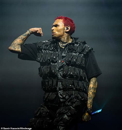 Chris Brown debuts red hair as he performs in Dublin - after reacting to Rihanna's Super Bowl ...