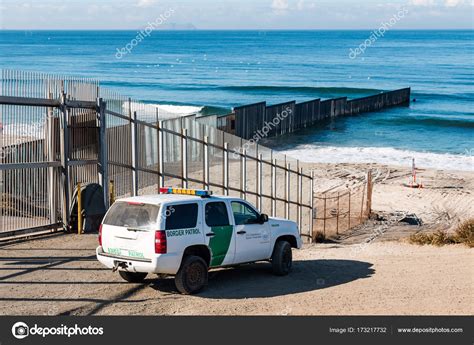 Border Patrol Vehicle Near U.S./Mexico Border Wall at Pacific Ocean ...