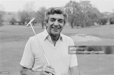 English singer Frankie Vaughan pictured holding a golf club on an... News Photo - Getty Images