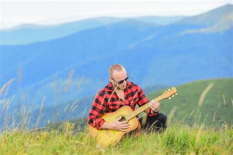 Keep Calm And Play Guitar. Man With Guitar On Top Of Mountain. Acoustic ...