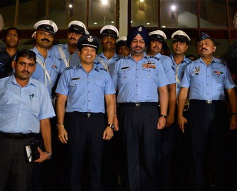 Sachin Tendulkar, an honorary Indian Air Force Group Captain, shares a moment with the Indian ...