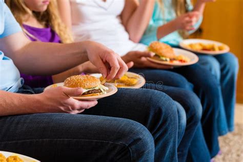 Family Is Eating Hamburger Or Fast Food Stock Photo - Image of kids ...